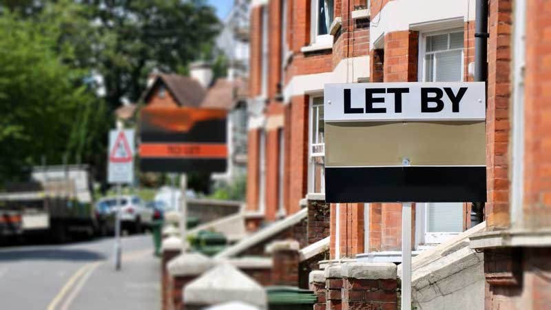 to let sign outside row of houses